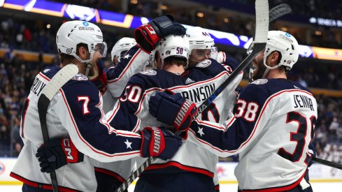 Columbus Blue Jackets' Eric Robinson celebrates his goal with teammates during the third period against the Buffalo Sabres at KeyBank Center.