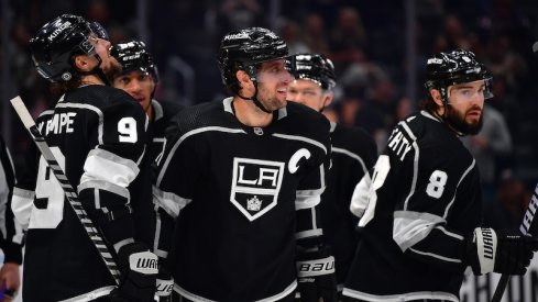 Los Angeles Kings' Anze Kopitar celebrates his goal scored against the Columbus Blue Jackets with Adrian Kempe and Drew Doughty during the second period at Crypto.com Arena.