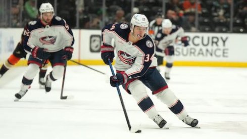 Cole Sillinger skates with the puck in the Blue Jackets vs. Ducks game. 