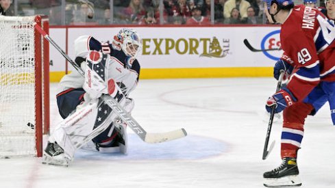 Rafael Harvey-Pinard scores a goal in the Blue Jackets vs. Canadiens game.