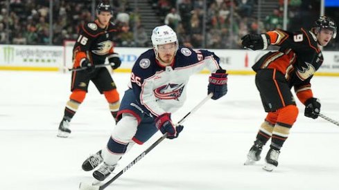 Jack Roslovic skates with the puck in the Ducks vs. Blue Jackets game.