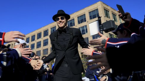 Columbus Blue Jackets goaltender Elvis Merzlikins (90) high-fives fans as he walks the Blue Carpet prior to the game against the Tampa Bay Lightning at Nationwide Arena.