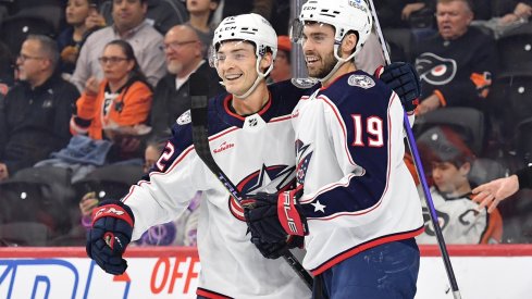 Carson Meyer and Liam Foudy celebrate a goal