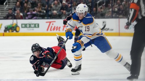 Buffalo Sabres center Peyton Krebs (19) skates with the puck while Columbus Blue Jackets defenseman Billy Sweeney (6) defends during the first period at Nationwide Arena.