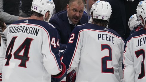 Brad Larsen talks to his players during a Blue Jackets game