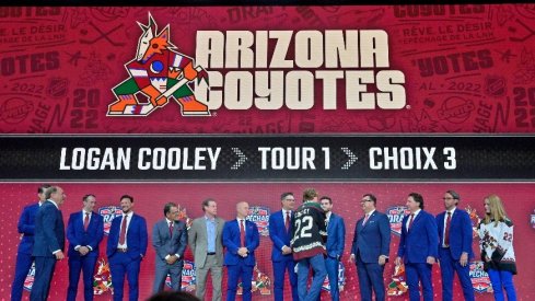 Logan Cooley after being selected as the number three overall pick to the Arizona Coyotes in the first round of the 2022 NHL Draft at Bell Centre.
