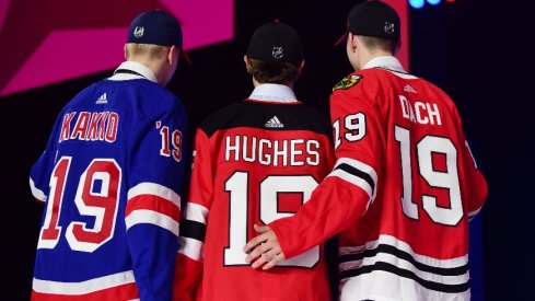 From left Kaapo Kakko (New York Rangers) , Jack Hughes (New Jersey Devils) and Kirby Dach (Chicago Blackhawks) pose with their new team jerseys after being drafted as the top three overall picks in the first round of the 2019 NHL Draft at Rogers Arena.