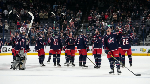 Columbus Blue Jackets players celebrate after the game against the Buffalo Sabres at Nationwide Arena