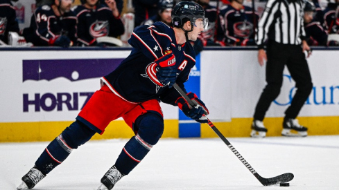 Columbus Blue Jackets defenseman Zach Werenski (8) skates with the puck against the Philadelphia Flyers in the first period at Nationwide Arena.