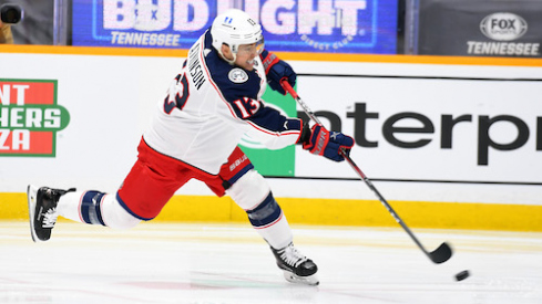 Columbus Blue Jackets forward Cam Atkinson (13) attempts a shot during the second period against the Nashville Predators at Bridgestone Arena.