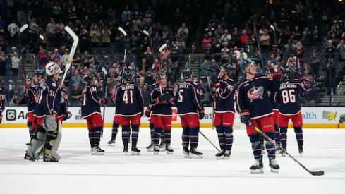 Columbus Blue Jackets players celebrate after the game against the Buffalo Sabres at Nationwide Arena.
