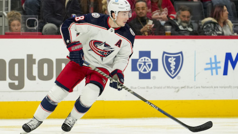 Columbus Blue Jackets defenseman Zach Werenski (8) skates with the puck during the second period against the Detroit Red Wings at Little Caesars Arena.