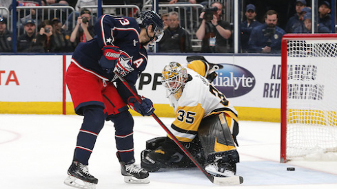 Columbus Blue Jackets left wing Johnny Gaudreau (13) scores a goal against Pittsburgh Penguins goalie Tristan Jarry (35) during overtime at Nationwide Arena.
