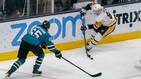 Pittsburgh Penguins center Sidney Crosby skates against former San Jose Sharks defenseman Erik Karlsson