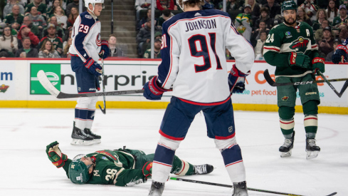 Minnesota Wild's Mats Zuccarello lays down on the ice in front of Columbus Blue Jackets' Kent Johnson in the second period at Xcel Energy Center.