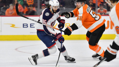 Columbus Blue Jackets right wing Kirill Marchenko (86) is defended by Philadelphia Flyers defenseman Rasmus Ristolainen (55) during the first period at Wells Fargo Center.