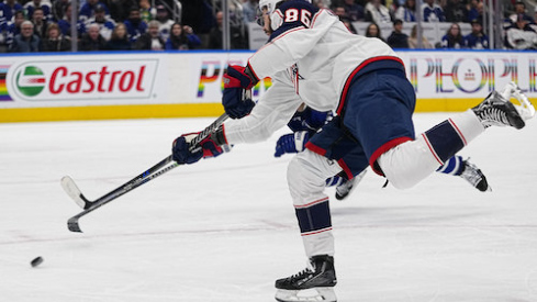 Columbus Blue Jackets forward Kirill Marchenko (86) shoots the puck against the Toronto Maple Leafs during the second period at Scotiabank Arena.