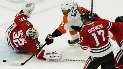 Philadelphia Flyers defenseman Ivan Provorov (9) scores a goal on Chicago Blackhawks goaltender Alex Stalock (32) during overtime at United Center.