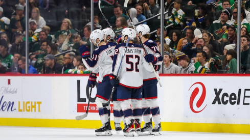 Columbus Blue Jackets' Adam Fantilli celebrates his goal against the Minnesota Wild with teammates during the third period at Xcel Energy Center.