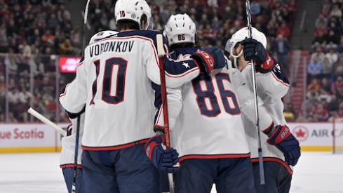 Columbus Blue Jackets forward Emil Bemstrom (52) celebrates with teammates after scoring a goal against the Montreal Canadiens during the first period at the Bell Centre.