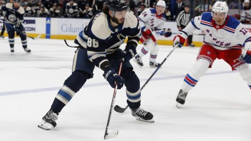 Columbus Blue Jackets' Kirill Marchenko looks to pass as New York Rangers' Nick Bonino defends during the first period at Nationwide Arena.