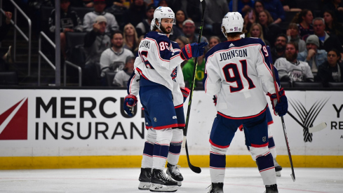 Kirill Marchenko celebrates with Kent Johnson