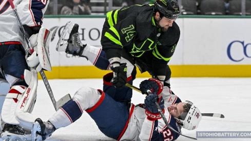 Jake Bean is on the receiving end of a check in a 5-3 loss to the Dallas Stars.