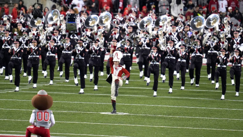 The Ohio State University Marching Band enter the field during the NCAA football game against Michigan State University at Ohio Stadium.