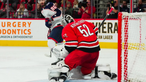 Carolina Hurricanes' Pyotr Kochetkov makes the save in front of Columbus Blue Jackets' Kirill Marchenko during the second period at PNC Arena.