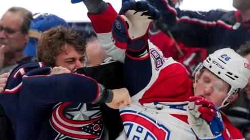 Columbus Blue Jackets center Sean Kuraly (7) scrums with Montreal Canadiens center Christian Dvorak (28) during a stop in play in the second period at Nationwide Arena.