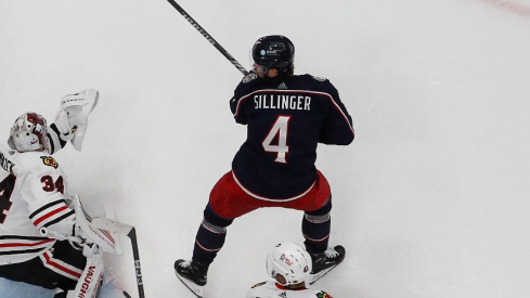 Columbus Blue Jackets Forward Cole Sillinger (4) tips the puck past Chicago Blackhawks goalie Petr Mrazek (34) for a goal during the second period at Nationwide Arena.