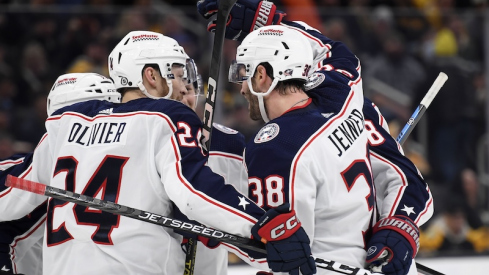 Columbus Blue Jackets' Boone Jenner celebrates his goal with Mathieu Olivier and the rest of his line mates during the second period against the Boston Bruins at TD Garden.