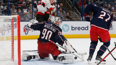 Columbus Blue Jackets goalie Elvis Merzlikins (90) makes a pad save against the Ottawa Senators during the third period at Nationwide Arena.