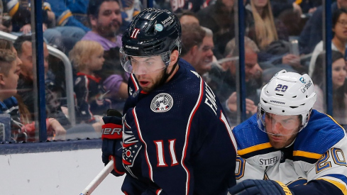 Columbus Blue Jackets center Adam Fantilli (11) picks up a loose puck as St. Louis Blues left wing Brandon Saad (20) trails the play during the first period at Nationwide Arena.