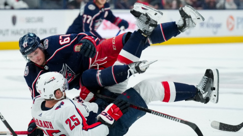 Columbus Blue Jackets left wing James Malatesta (67) checks Washington Capitals defenseman Dylan McIlrath (25) in the second period at Nationwide Arena.