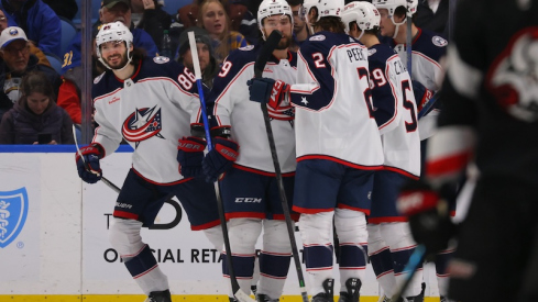 Columbus Blue Jackets' Kirill Marchenko celebrates his third goal of the game with teammates during the second period against the Buffalo Sabres at KeyBank Center.