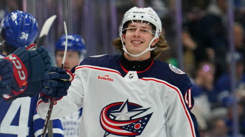 Columbus Blue Jackets forward Kent Johnson (91) gets congratulated after scoring against the Toronto Maple Leafs during the first period at Scotiabank Arena.