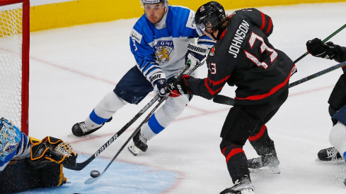 Team Canada forward Kent Johnson (13) scores the overtime winning goal against Team Finland in the championship game during the IIHF U20 Ice Hockey World Championship at Rogers Place.