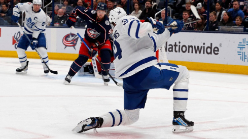 Toronto Maple Leafs center Auston Matthews (34) follows through on a slap shot for a goal against the Columbus Blue Jackets during the second period at Nationwide Arena.