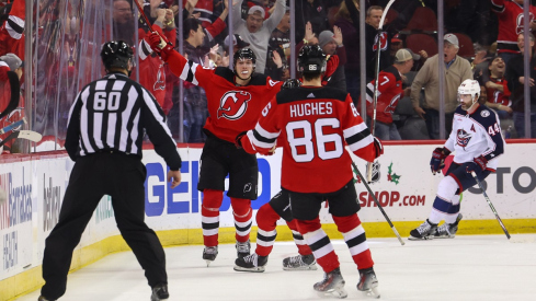 Luke Hughes celebrates his goal against the Columbus Blue Jackets