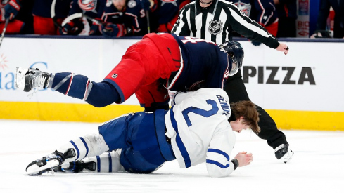 Columbus Blue Jackets defenseman Erik Gudbranson (44) and Toronto Maple Leafs defenseman Simon Benoit (2) fight during the second period at Nationwide Arena.