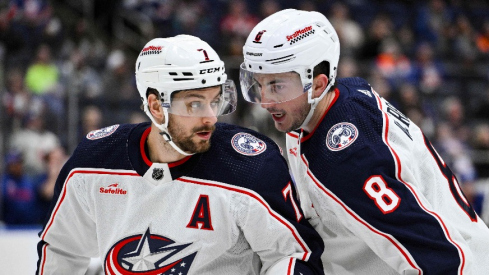 Columbus Blue Jackets center Sean Kuraly (7) and Columbus Blue Jackets defenseman Zach Werenski (8) talk during the first period against the New York Islanders at UBS Arena.