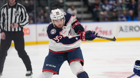 Columbus Blue Jackets defeneseman David Jiricek (55) shoots the puck past Toronto Maple Leafs forward Calle Jarnkrok (19) during the second period at Scotiabank Arena.