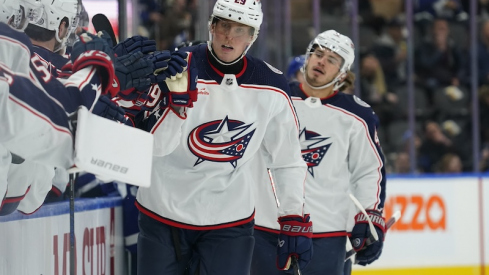Columbus Blue Jackets' Patrik Laine gets congratulated after scoring against the Toronto Maple Leafs during the first period at Scotiabank Arena.