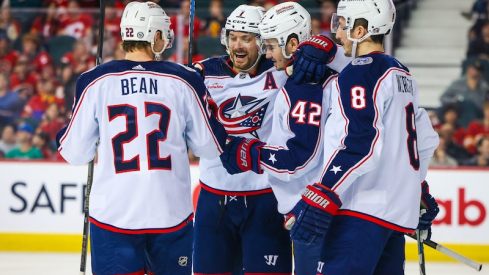 Columbus Blue Jackets' Alexandre Texier celebrates his goal with teammates against the Calgary Flames during the second period at Scotiabank Saddledome.