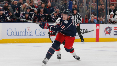 Columbus Blue Jackets defenseman Zach Werenski (8) follows though on a shot against the Ottawa Senators during the second period at Nationwide Arena.