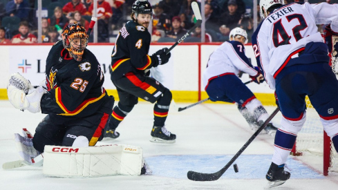 Columbus Blue Jackets center Alexandre Texier (42) scores a goal against Calgary Flames goaltender Jacob Markstrom (25) during the second period at Scotiabank Saddledome.