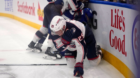 Columbus Blue Jackets forward Patrik Laine (29) grabs his shoulder after being upended by Toronto Maple Leafs defenseman William Lagesson (85) during the second period at Scotiabank Arena.