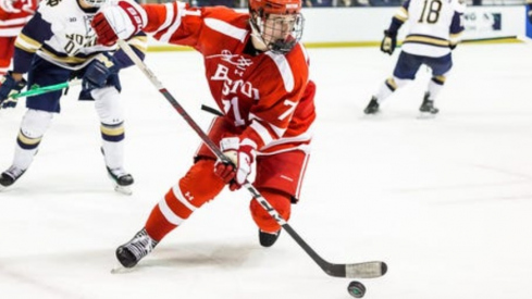 Boston University forward Macklin Celebrini (71) skates with the puck during the Boston University-Notre Dame NCAA hockey game on Saturday, October 21, 2023, at Compton Family Ice Arena in South Bend, Indiana.