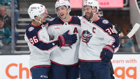 Columbus Blue Jackets' Zach Werenski celebrates with Jack Roslovic and Boone Jenner after scoring a goal against the San Jose Sharks during the first period at SAP Center at San Jose.
